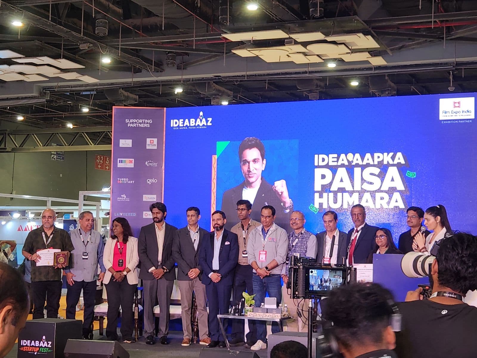 Team Finnulate on stage receiving the Go Global Challenge recognition at Ideabaaz Startup Fest 2026